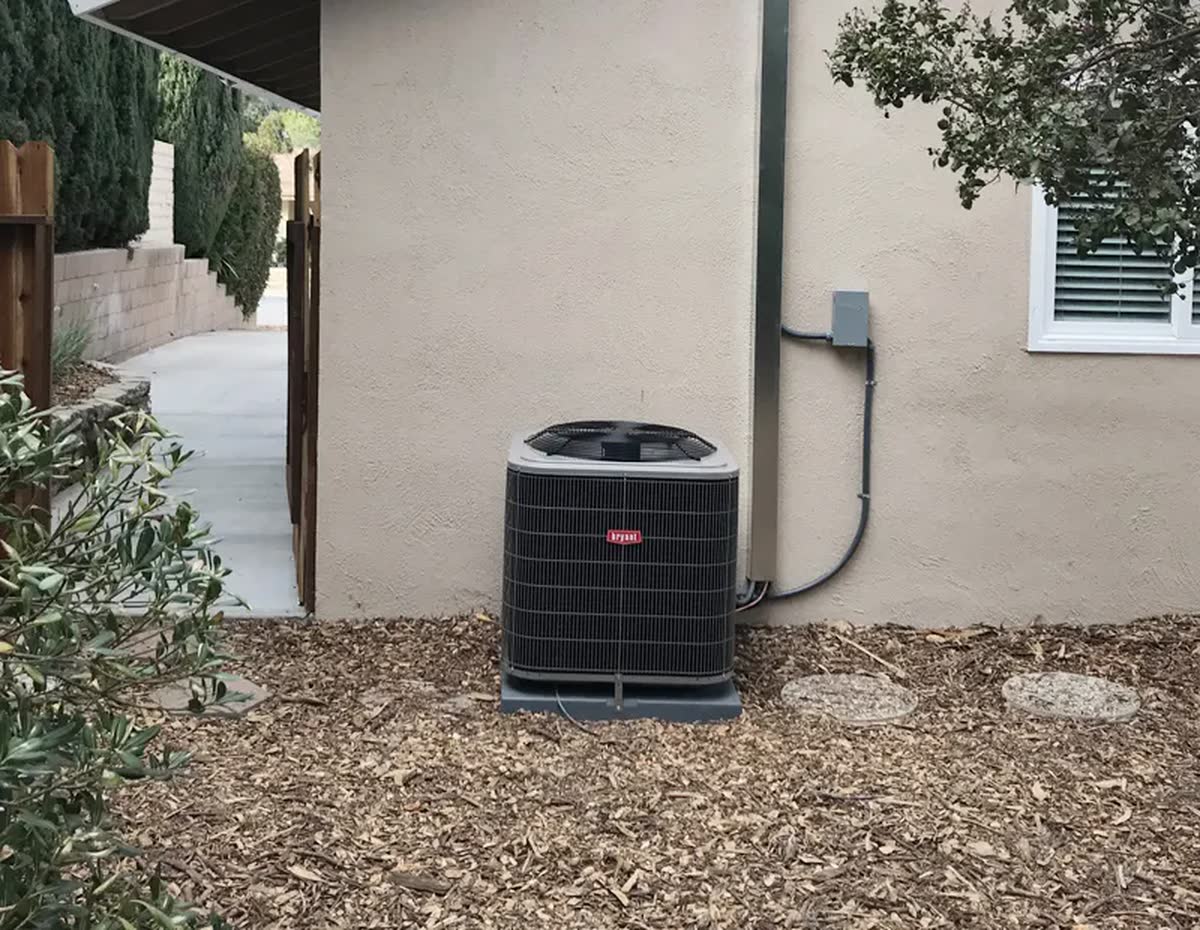 New condenser installed on a residential pad.