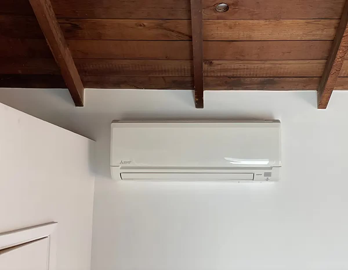 Ductless head mounted on an interior wall.