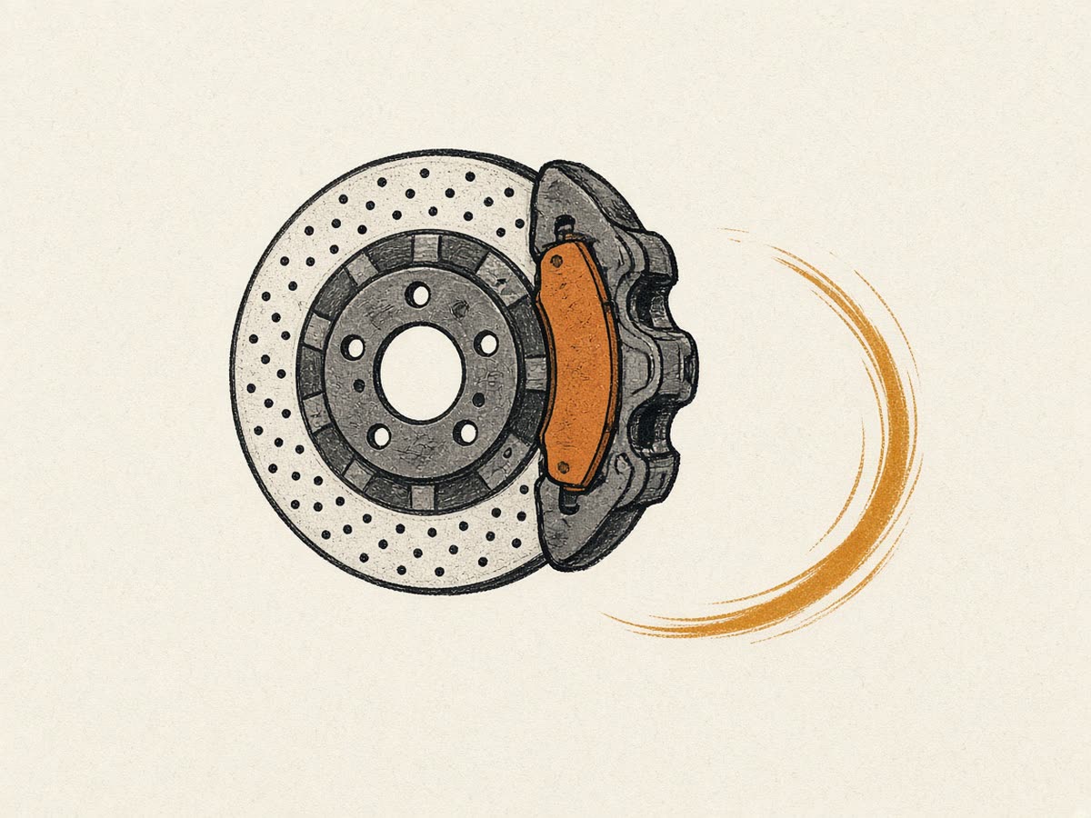 Line drawing of a brake disc and caliper.
