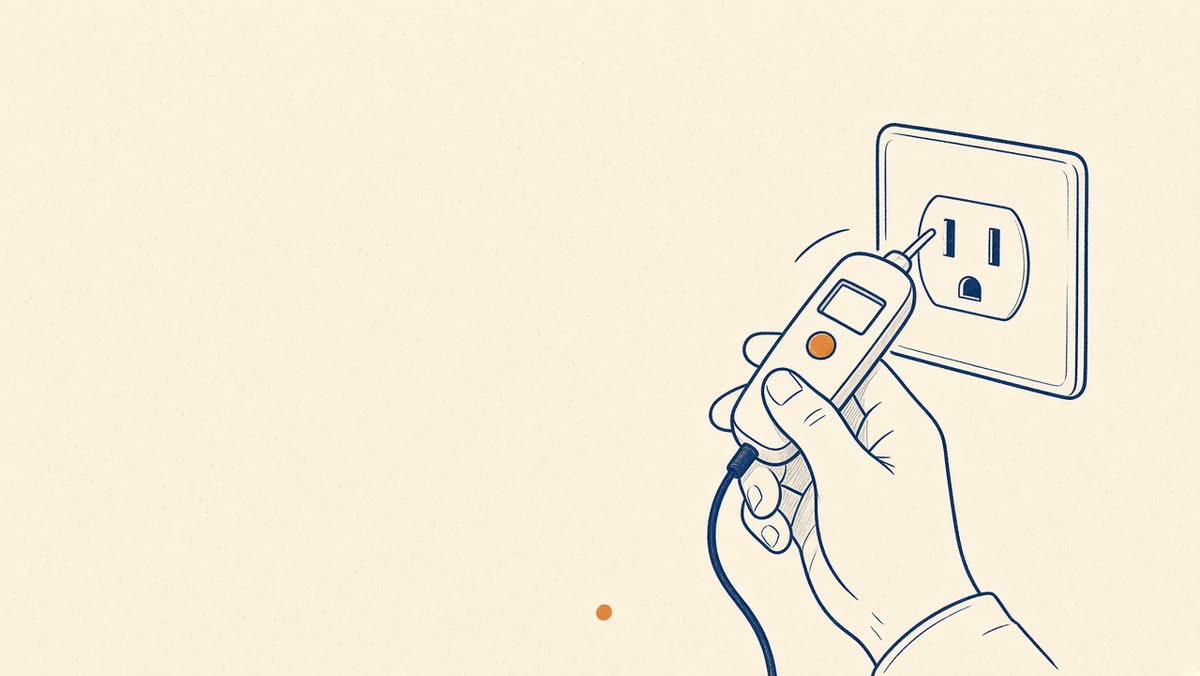 Line drawing of a hand testing an outlet with a meter.