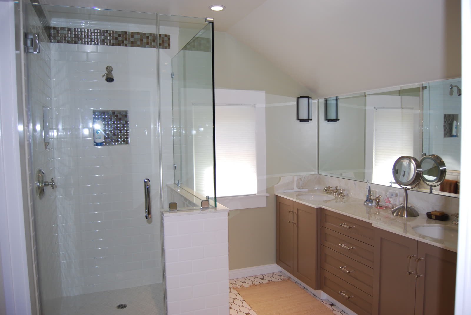 Remodeled bathroom with tiled shower by K.D. Clark Construction.
