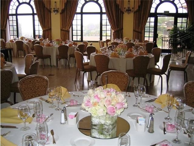 Upholstered dining chairs set for a banquet room.